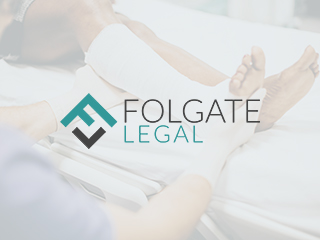 Image of a patient recieving treatment for a broken ankle with Folgate Legal's logo overlaid